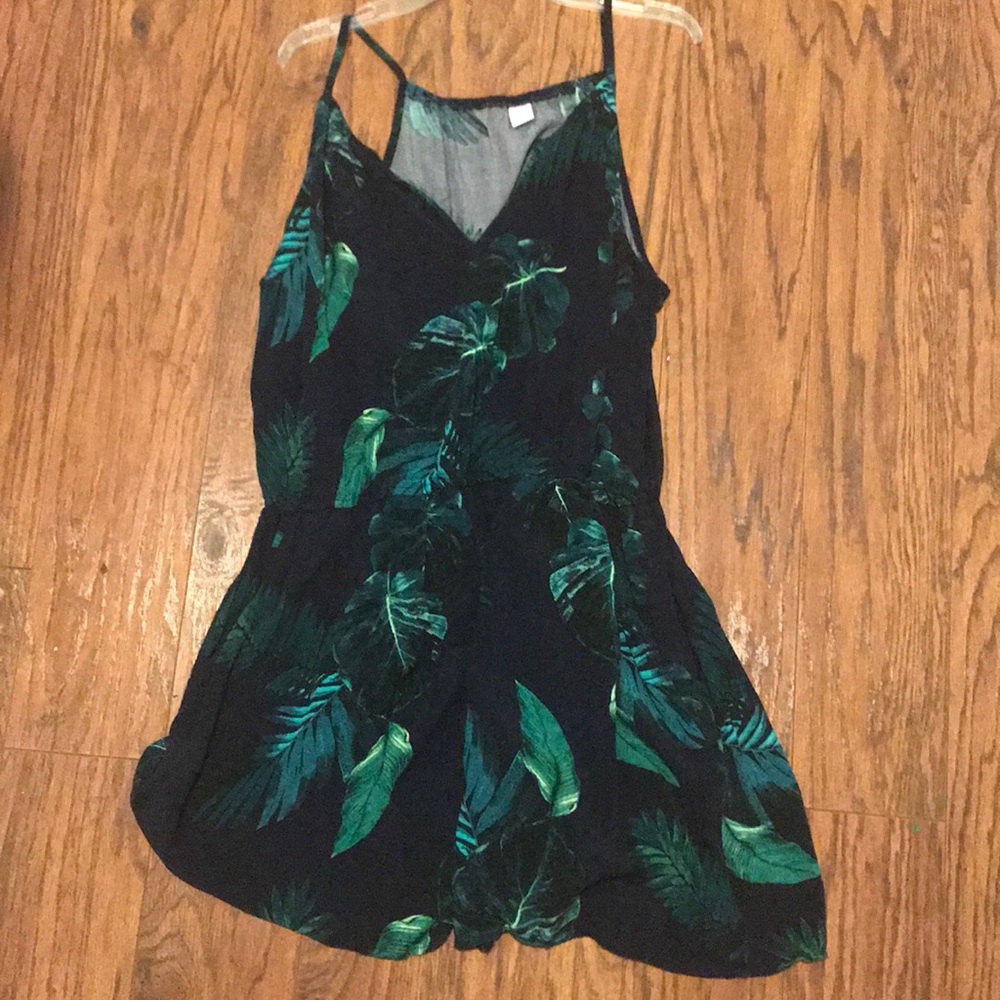 Navy blue romper with green leaves